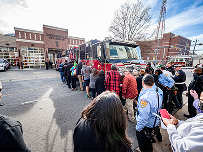 Community Pushing In Tiller Truck