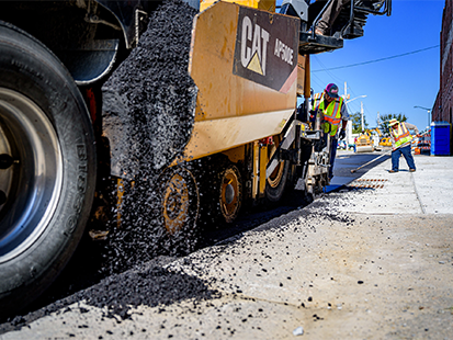 Crew paving a street