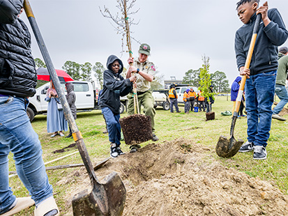 Children planting trees on Arbor Day