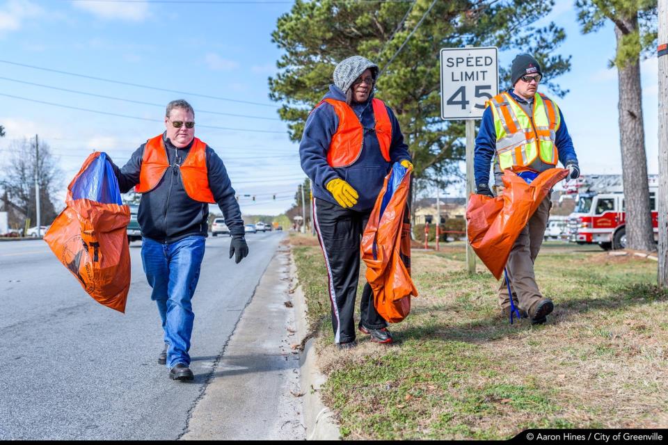 City staff cleaning roadway