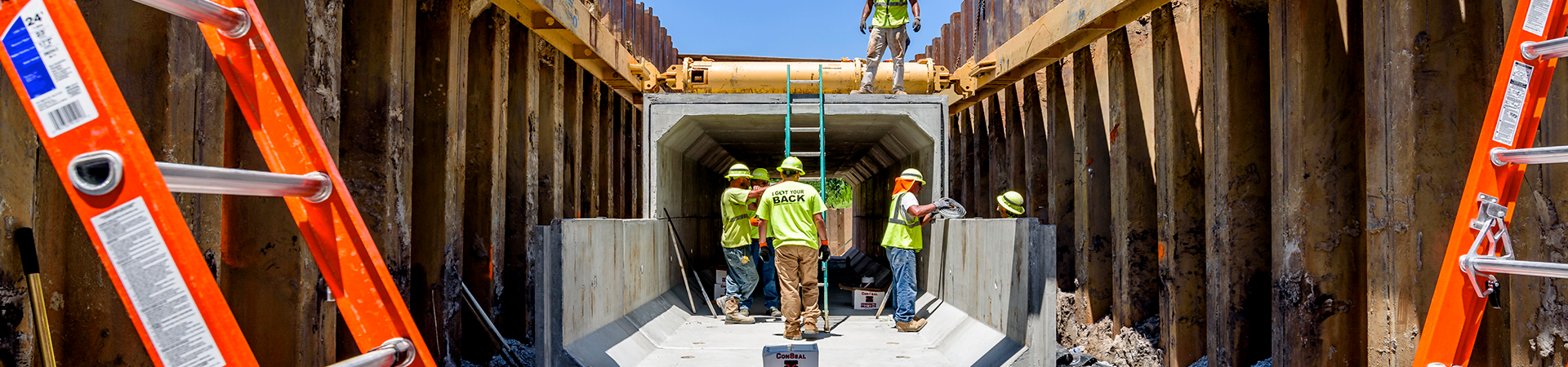 workers inside the town creek culvert