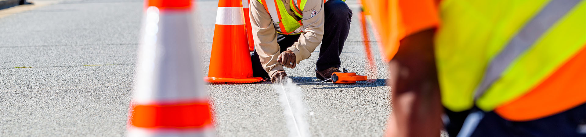 worker marking street lines