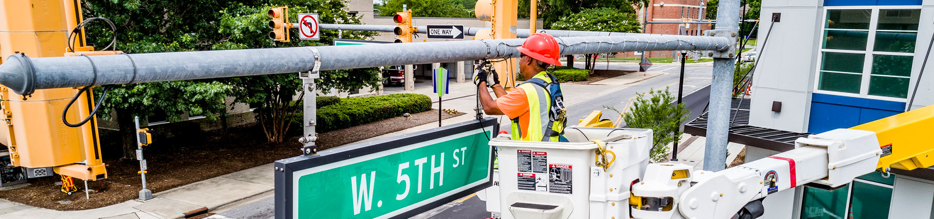 worker repairing a traffic light