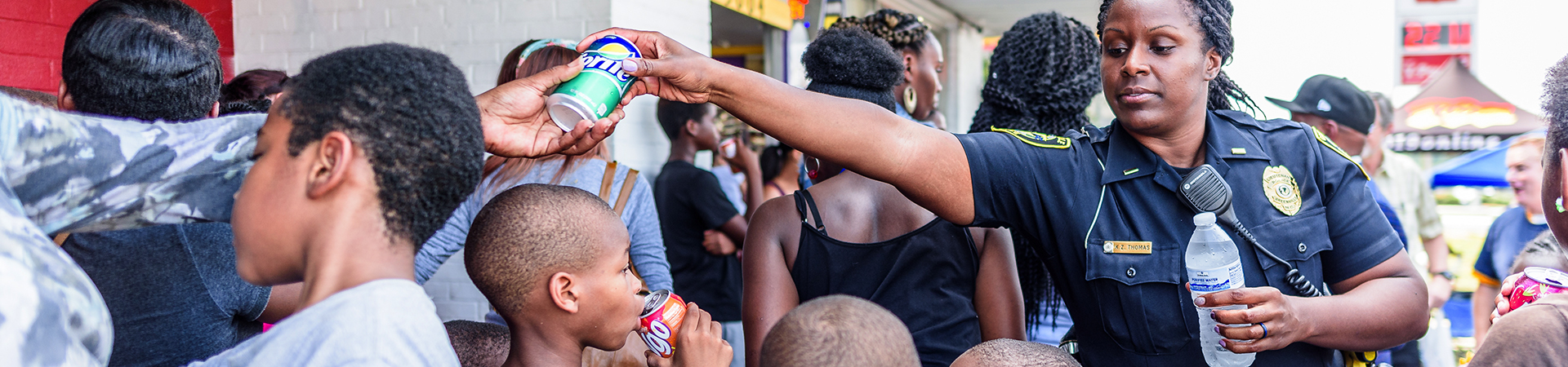 Police officer handing out drinks